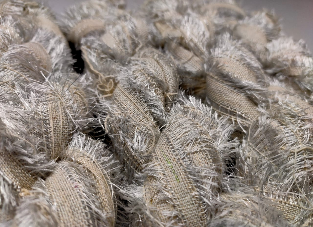 Recycled Metallic Frizz Ribbon is perfect for incorporating into weavings and adding contrasting texture. Metallic Frizz Ribbon can be used for creating home goods, rugs, wall art, and more. This recycled cotton ribbon is fair trade, ethically sourced from India, and hand dyed in small batches.