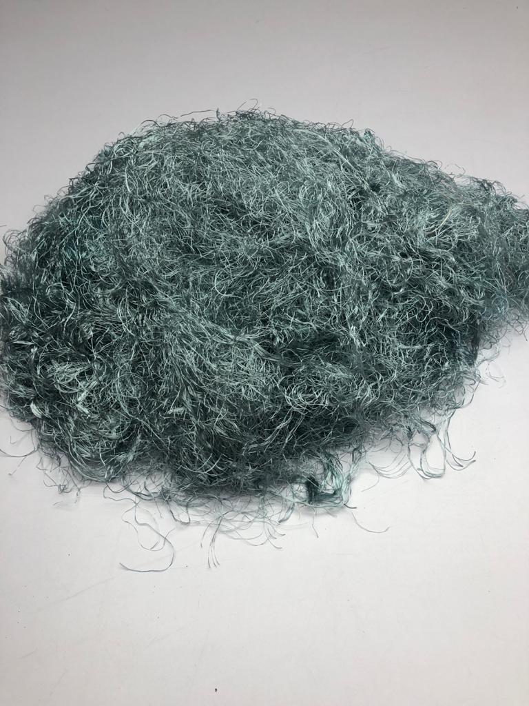 Banana viscose fiber in Grey, skein on white background - silk-routeindia
