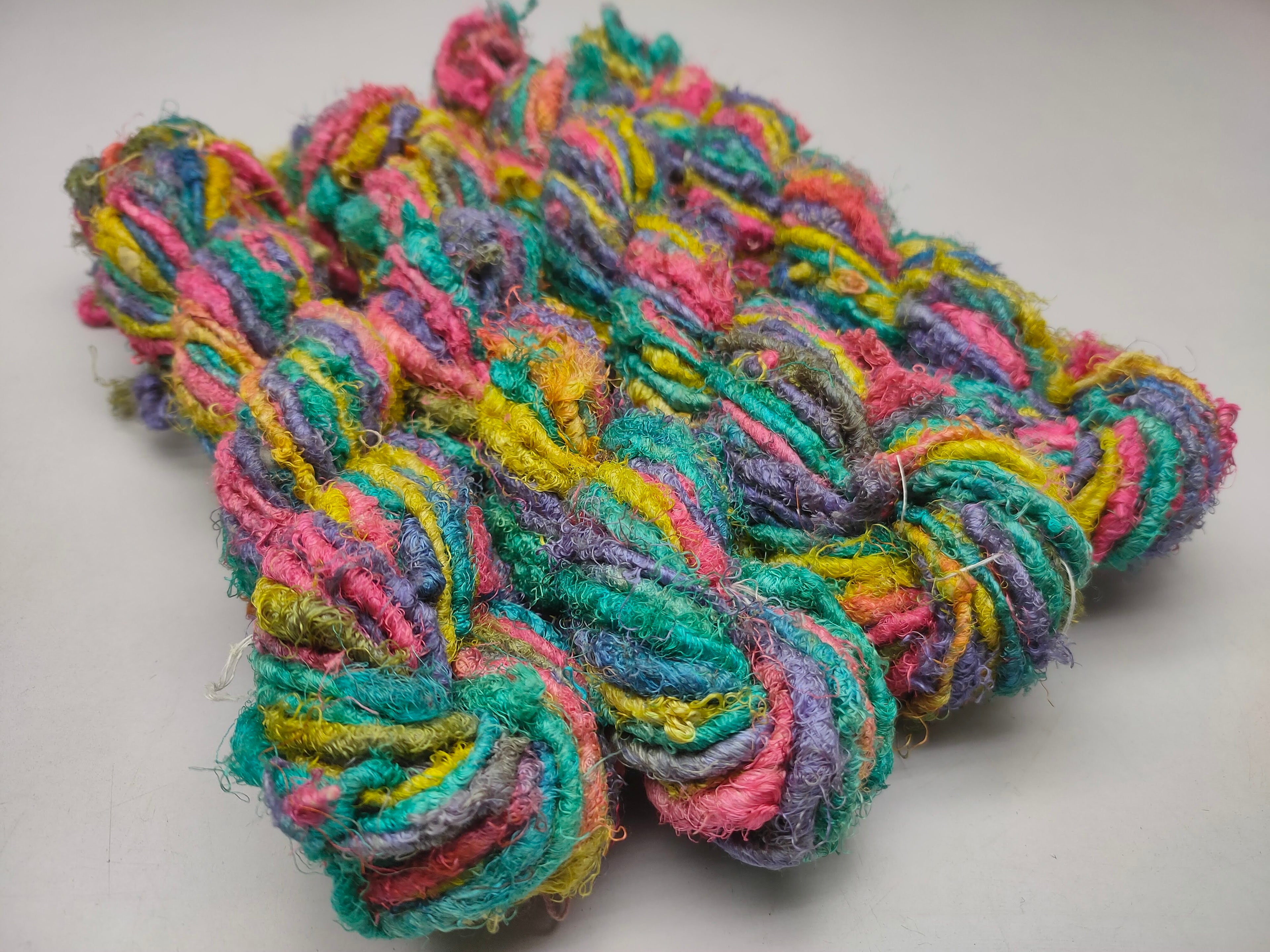 Recycle Sari Silk Yarn are the remnants of traditionally crafted Indian Saris and are extensively used in making hats, mittens, hued scarves, etc. We offer Recycle Sari Silk Yarn comprising of 100% and they are not over spun unlike some natural yarn. Each skein has distinct color, gauge, twist and texture. Varying in weight, our Recycled Sari Yarn are hailed for their quality and strength.