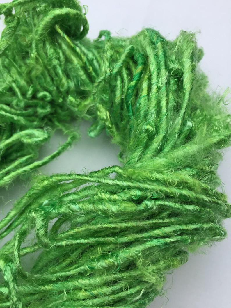 Banana yarn in Green, skein on white background - silk-routeindia