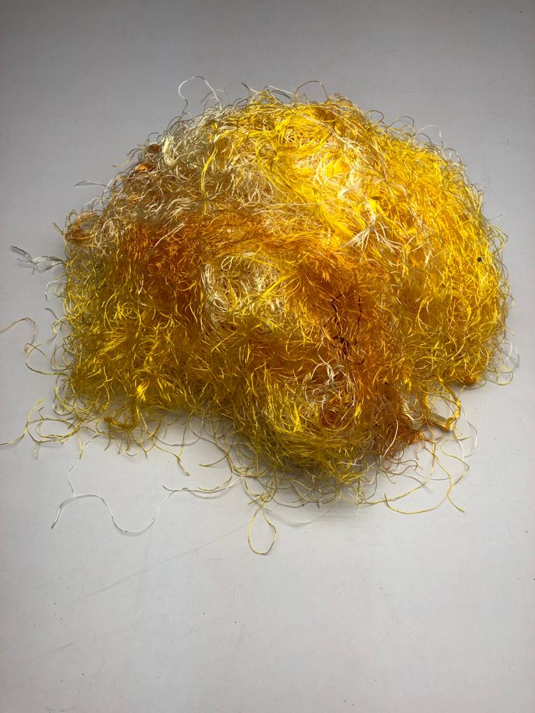Banana viscose fiber in Yellow, skein on white background - silk-routeindia