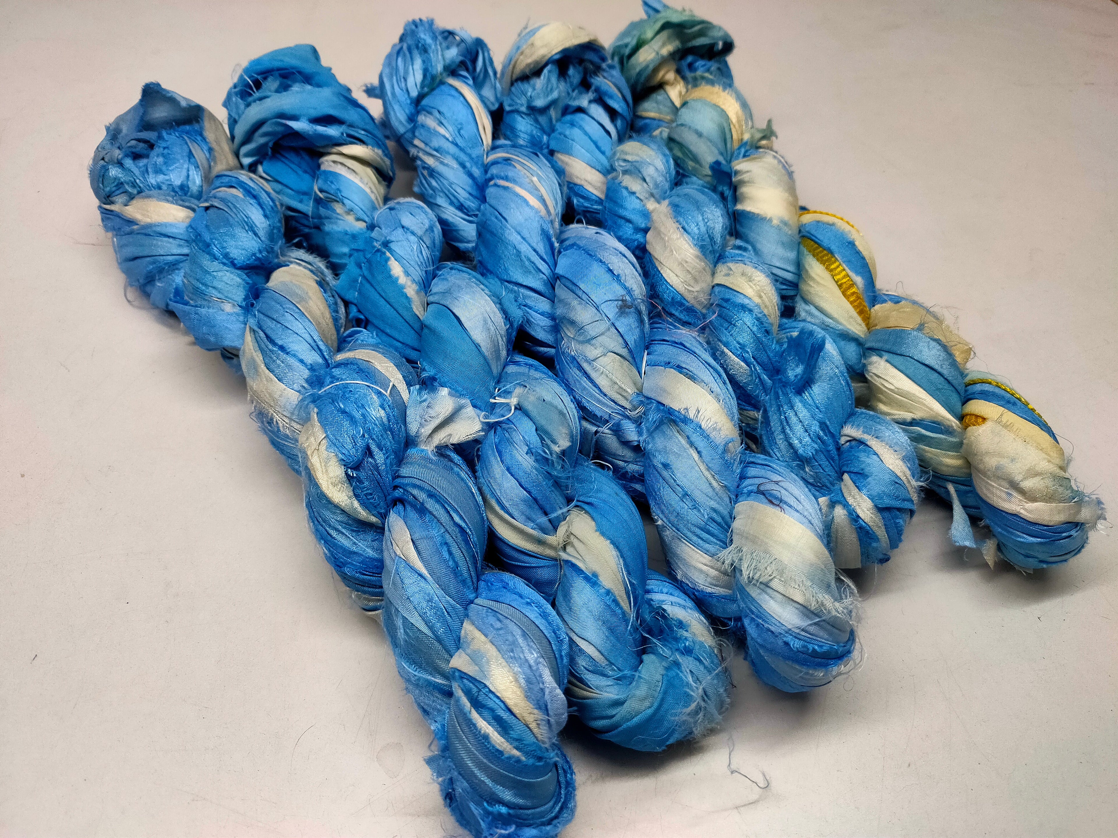 Recycled Sari Silk Ribbon - Cloud - SilkRouteIndia Recycled Sari SilK yarn, Recycled Sari Silk Ribbon, Recycled Sari yarn, Recycled Silk Ribbon,upcycled ribbon, upcycled yarn, Himalaya Silk Yarn, Recycle Sari silk,	Recycle Silk,	Yarn for Knitting,	Knitting Yarn,	Crochet Yarn,	handcrafted yarn,	recycle sari yarn,	Sari Silk Yarn, reused ribbon, recycled ribbon