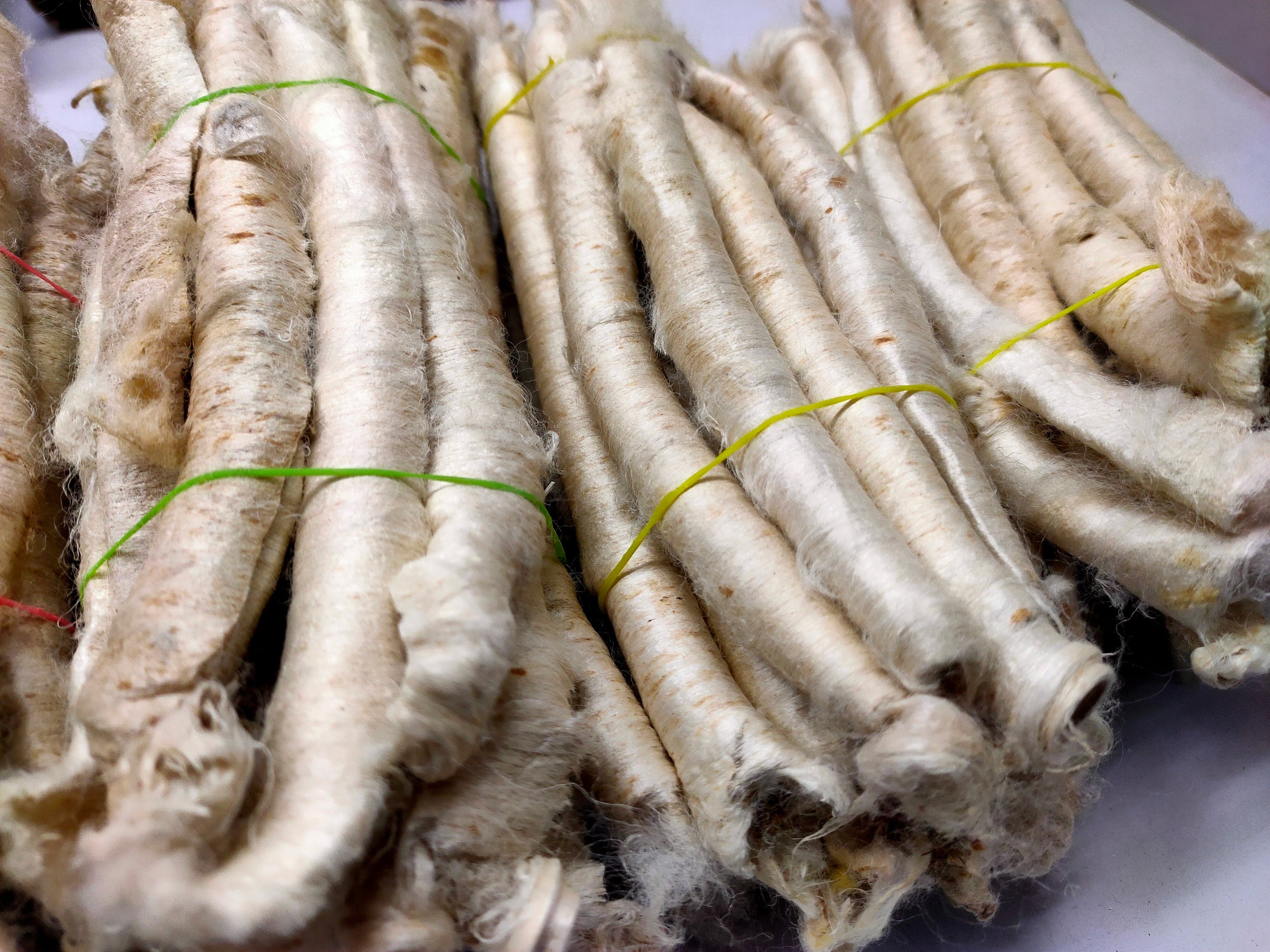 Mulberry Silk Carrier Rods are Perfect for surface texture during felting and can be dyed as per need. If you sprinkle it with water and iron them flat then you can create a sort of silk paper.